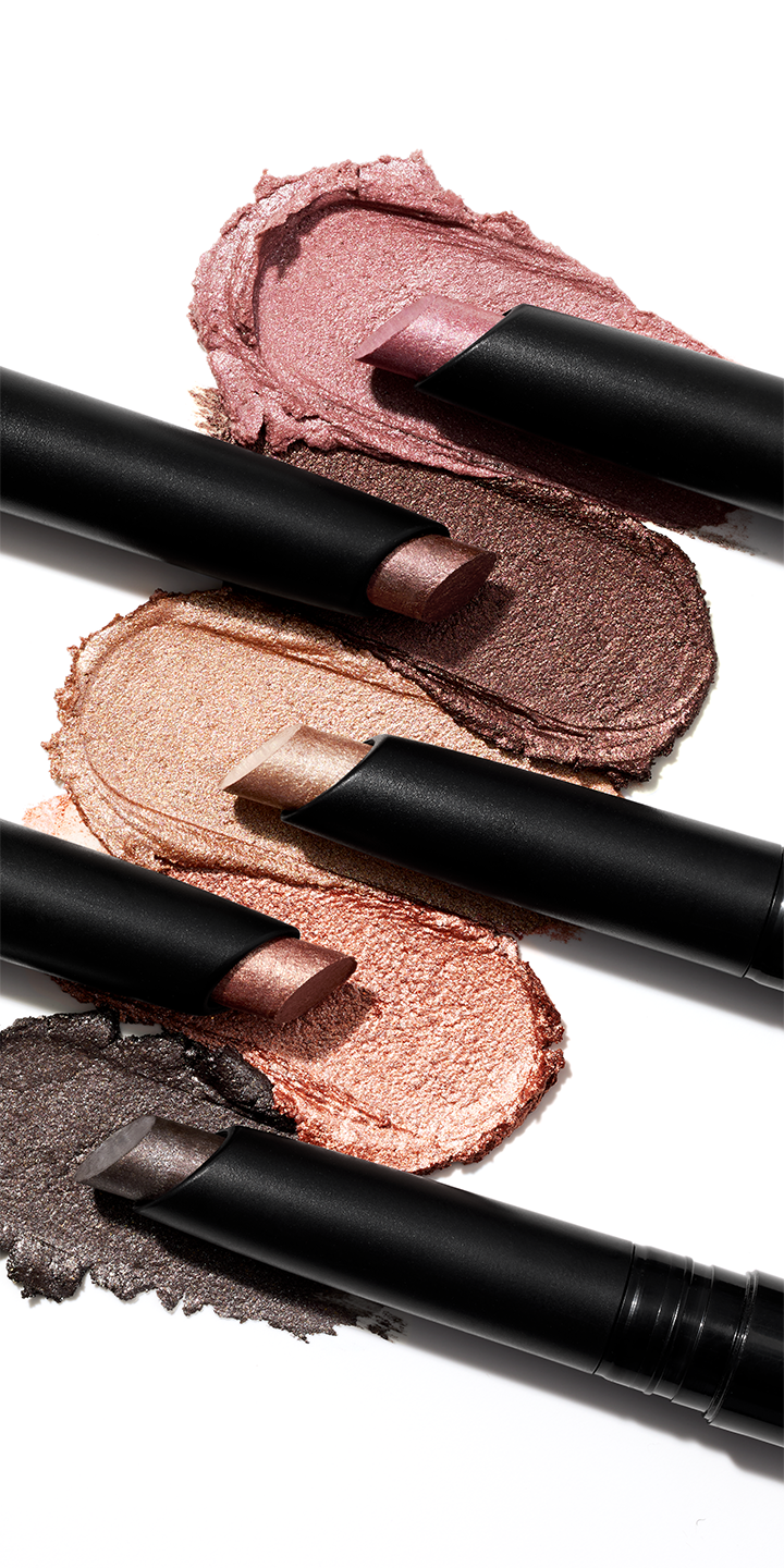 Group shot of 5 Mary Shimmer Eye Shadow Sticks with their texture rub alongside them